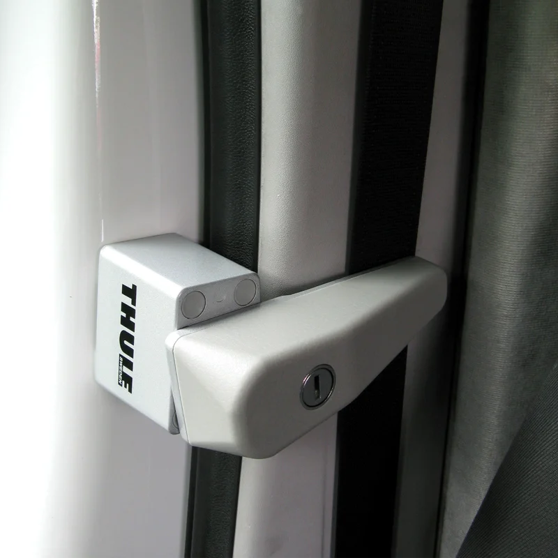 A white Thule Cab Lock inside a van.