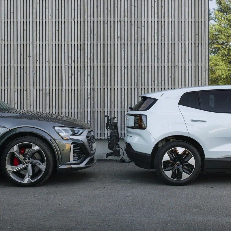 A tilted up Thule OutPace bike carrier attached to a car making it easy to park.